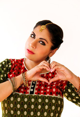 Woman dancing Indian dance in national dress. A beautiful girl portrait in shree kurta patiala set...