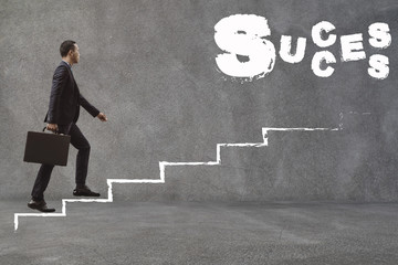 Asian Businessman walking up the stairs to find success.Conception of Business Success