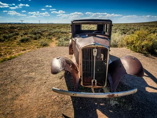 Poster Worn out car wreck on route 66 near Holbrook in Arizona, © Frankix