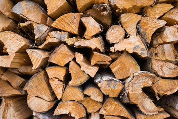 Stack of firewood for rough texture background