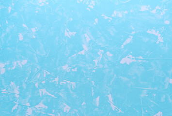 Light blue cracked concrete background (as an abstract background or concrete texture)