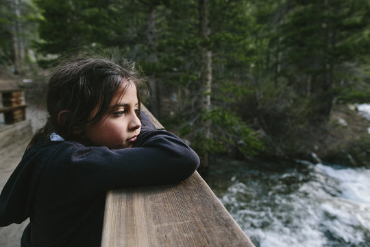 Girl leaning on bannister at Inyo National Forest