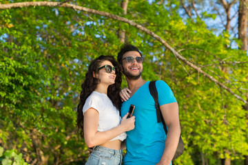 Fototapeta premium Couple Embracing Tropical Green Forest Summer Vacation, Beautiful Young People In Love, Man Woman Happy Smile Holiday Travel
