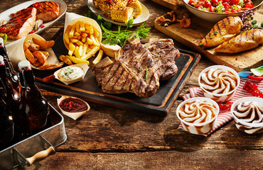 Meat served with french fries, corn and ice cream