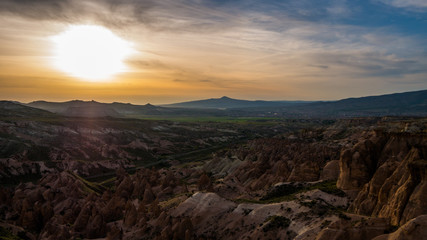 Amazing sunset over fairy rock formation in the mountains in Cappadocia, Central Anatolia,Turkey