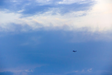 Fototapeta na wymiar plane against the background of the evening sky