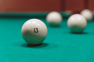 Billiard balls in a pool table. focus on the eight ball