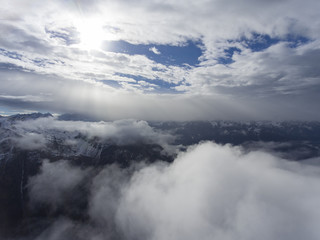 Aerial landscape with sun and mountains