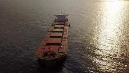 Large bulk carrier ship sailing in open ocean