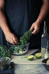 Kale recipes man preparing kale green avocado seeds detox salad
