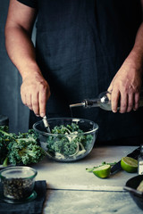 Kale recipes man preparing kale green avocado seeds detox salad
