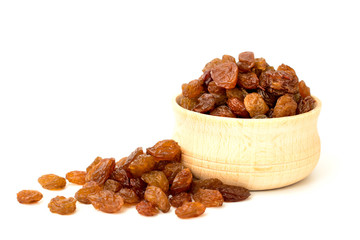 Raisins in a wooden Cup on a white