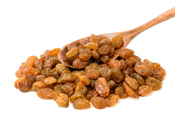 Raisins with a wooden spoon