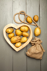 Potatoes on a gray wooden background