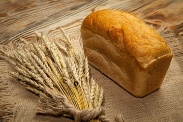 white bread or sliced bread in the basket on wooden floor with sack cloths.