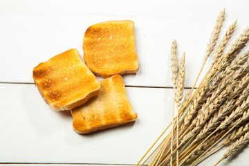 Toasts on a white wooden background