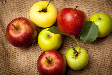 Fresh red apples in the wooden box. On wooden background. Free space for text . Top view