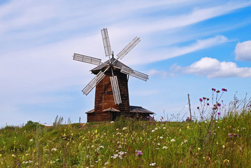 Lovely windmill on a field of flowers. Nizhnyaya Sinyachikha, Sverdlovsk oblast, Russia.