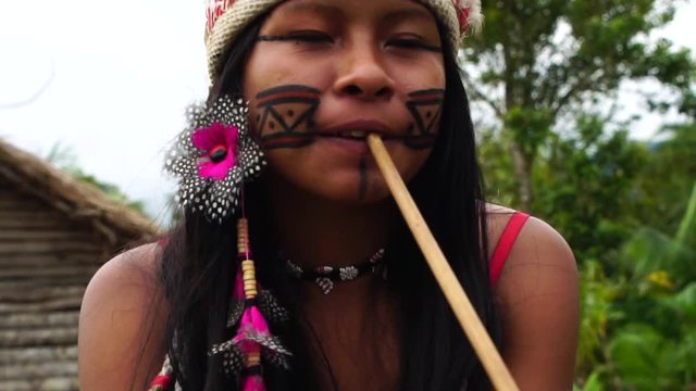 Indigenous Woman Smoking Pipes in a Tupi Guarani Tribe, Brazil