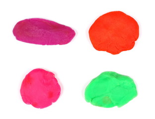 Set of colorful plasticine isolated on white background