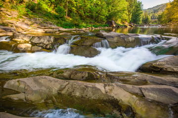 Mountain waterfall Probiy in the wood. Ukrainian Carpathians.