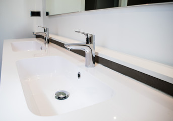 Two white sinks in the bathroom
