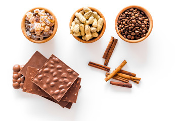 Ingredients for chocolates on white background top view