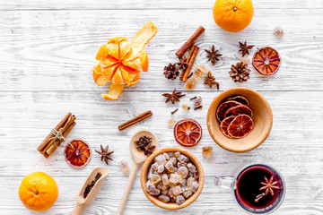 Ingredients mulled wine or grog with spices and citrus for winter evening. Christmas new year eve. Wooden background top view.