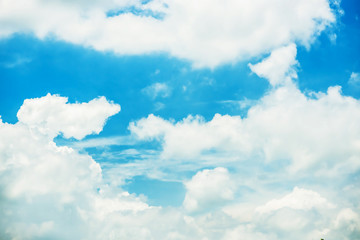 Naklejka na ściany i meble Fantastic soft white clouds against blue sky background