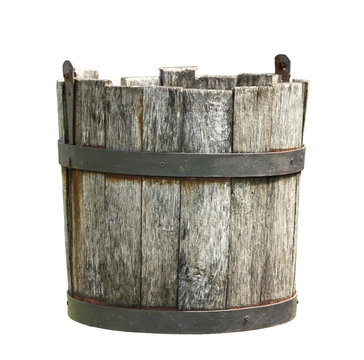 Old wooden bucket of water hanging on a white background