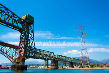 Photo of train tracks next to Iron Worker's Memorial Bridge in Vancouver, BC