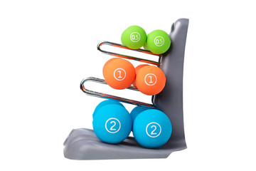 Set of colored isolated dumbbells for sport on a white background folded on a special gray stand