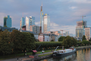 Fototapeta premium Evening city on river coast. Frankfurt am Main, Germany