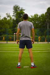 Obraz premium Image of a man in full growth on a football field