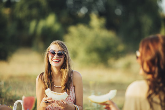 Young Woman Eating Melon