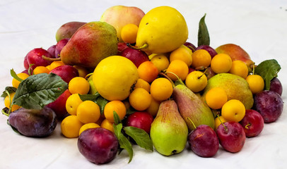 Plums and cherry pear close up.