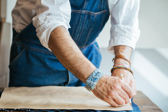Closeup on Male Hands Using Fabric Pencil