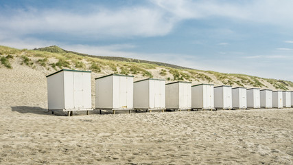 Row Of Huts On Beach Against Sky 