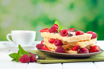 Breakfast with belgian waffles and cup of coffee