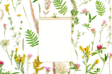 Open notebook with blank space for text on wildflowers background