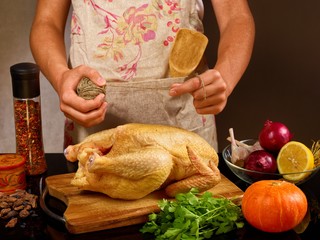 food photo cook in apron prepares chicken