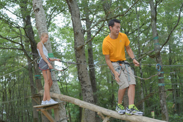 couple climbing rope at the adventure park