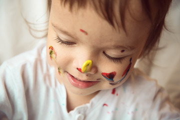 Girl playing with paints