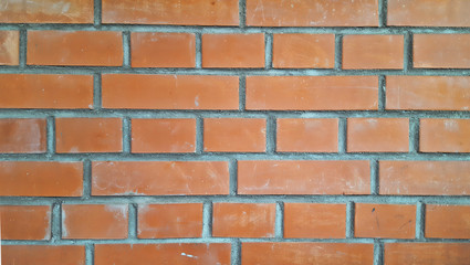 Beautiful flat wall of red brick, texture or background, closeup.