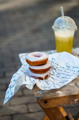 Donuts in paper pack and fresh smoothie street food