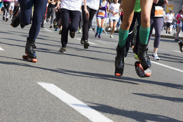 Marathon running race, people feet on city road