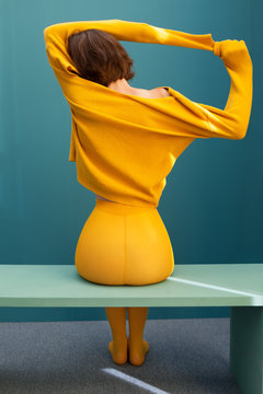 Young woman with yellow clothes