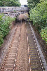 Obraz premium Tracks with brick arch bridge