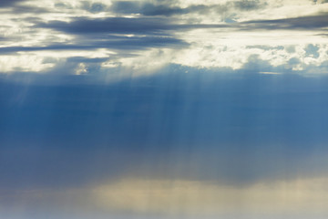 Fototapeta premium Blue Sky with Sun Rays Radiate through Clouds, background