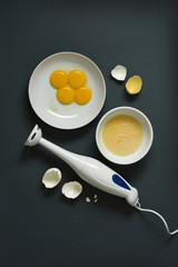 blender and eggs on the table - closeup